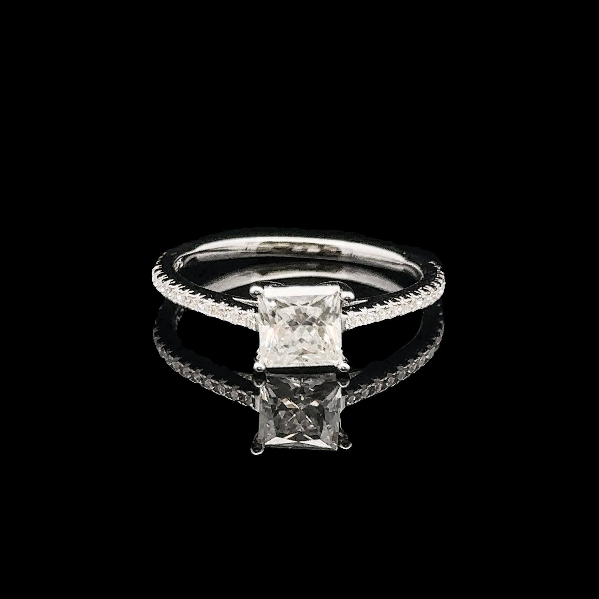 Princess cut moissanite engagement ring in 925 silver, showcasing intricate details and brilliance.