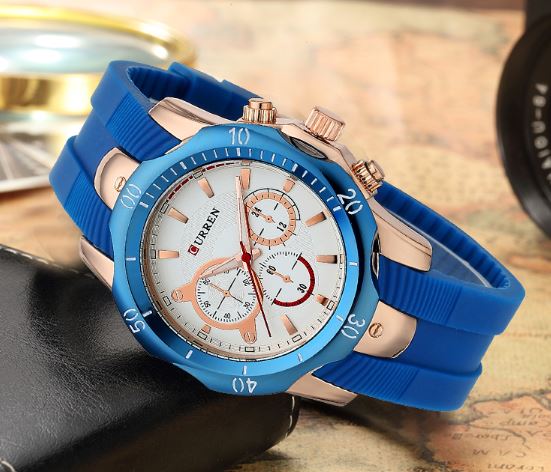 Close-up of the Curren MOUNTAINEER premium gold men's wristwatch with decorative sub dials.