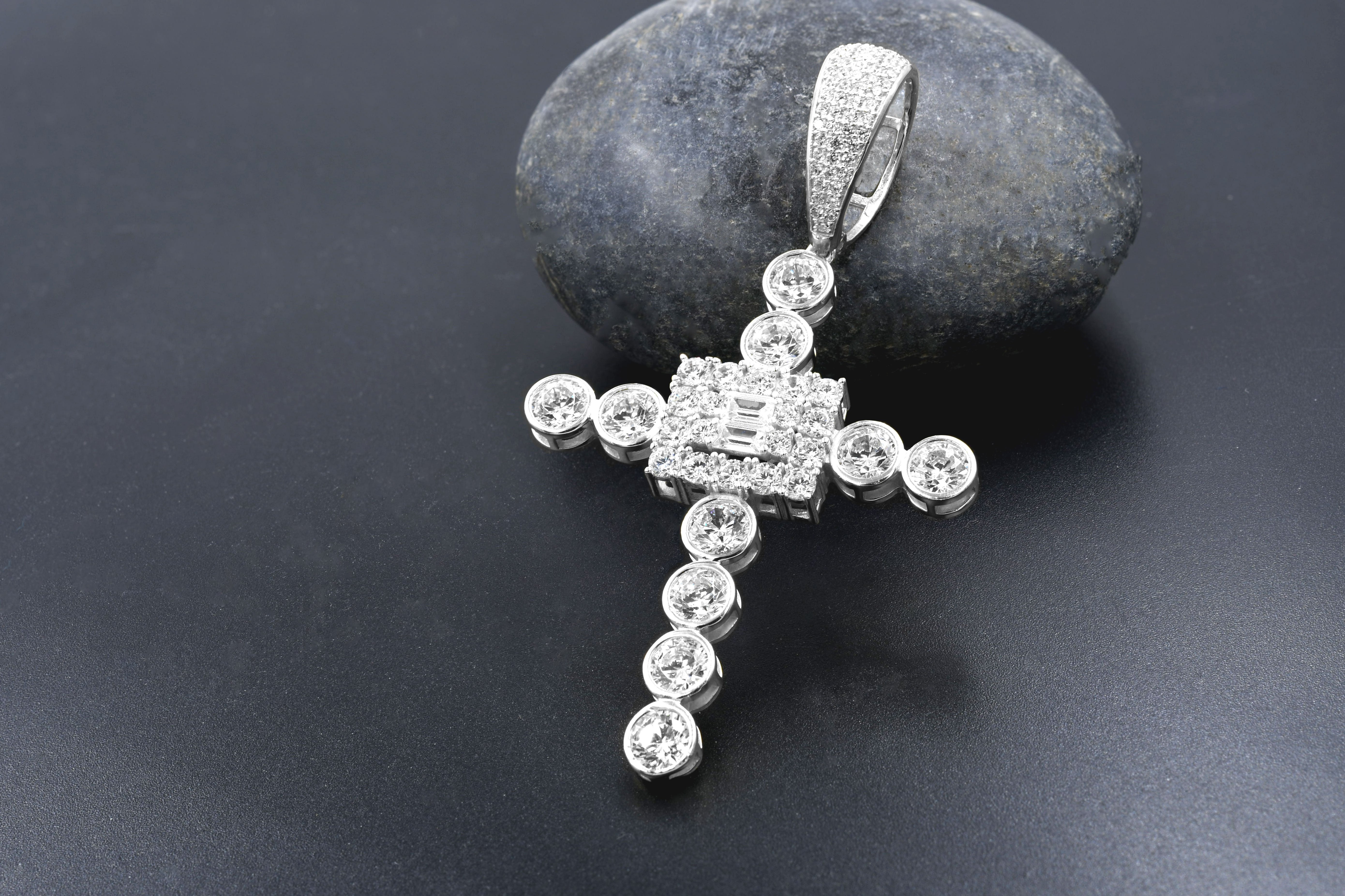 Angelic silver cross pendant with cubic zirconia, front view